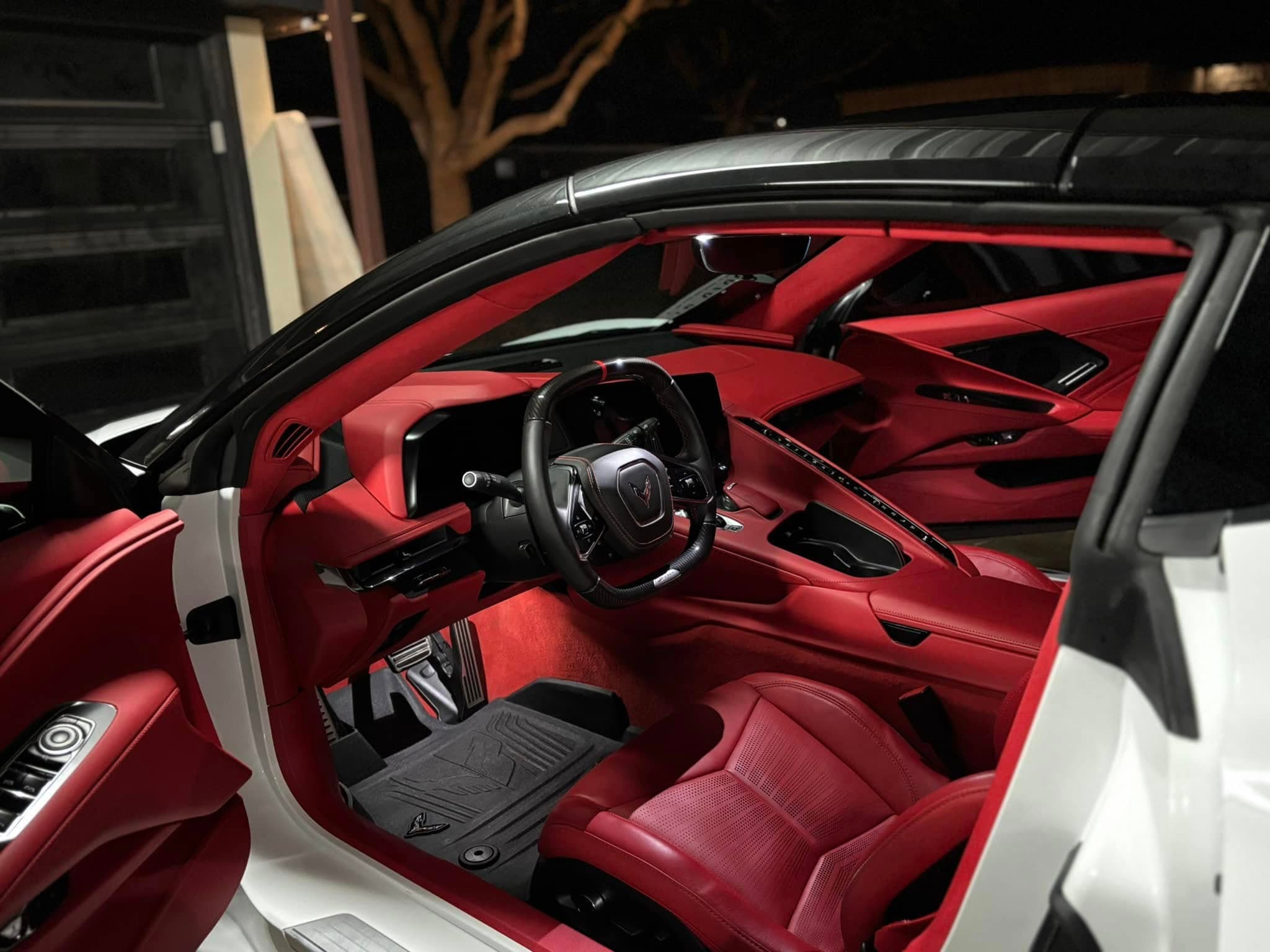 Red Corvette leather cabin detailed under evening light