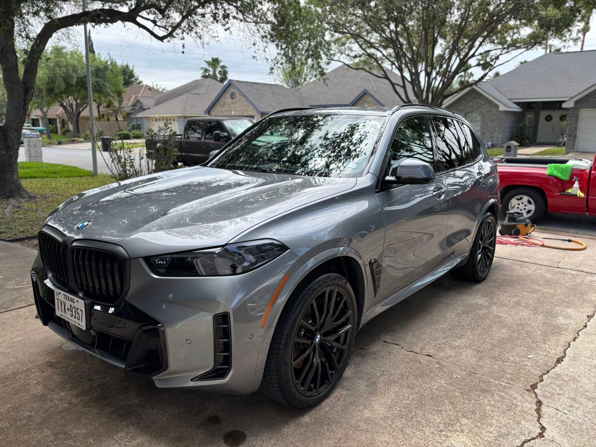Silver BMW X5 with mirror-finish gloss after detailing