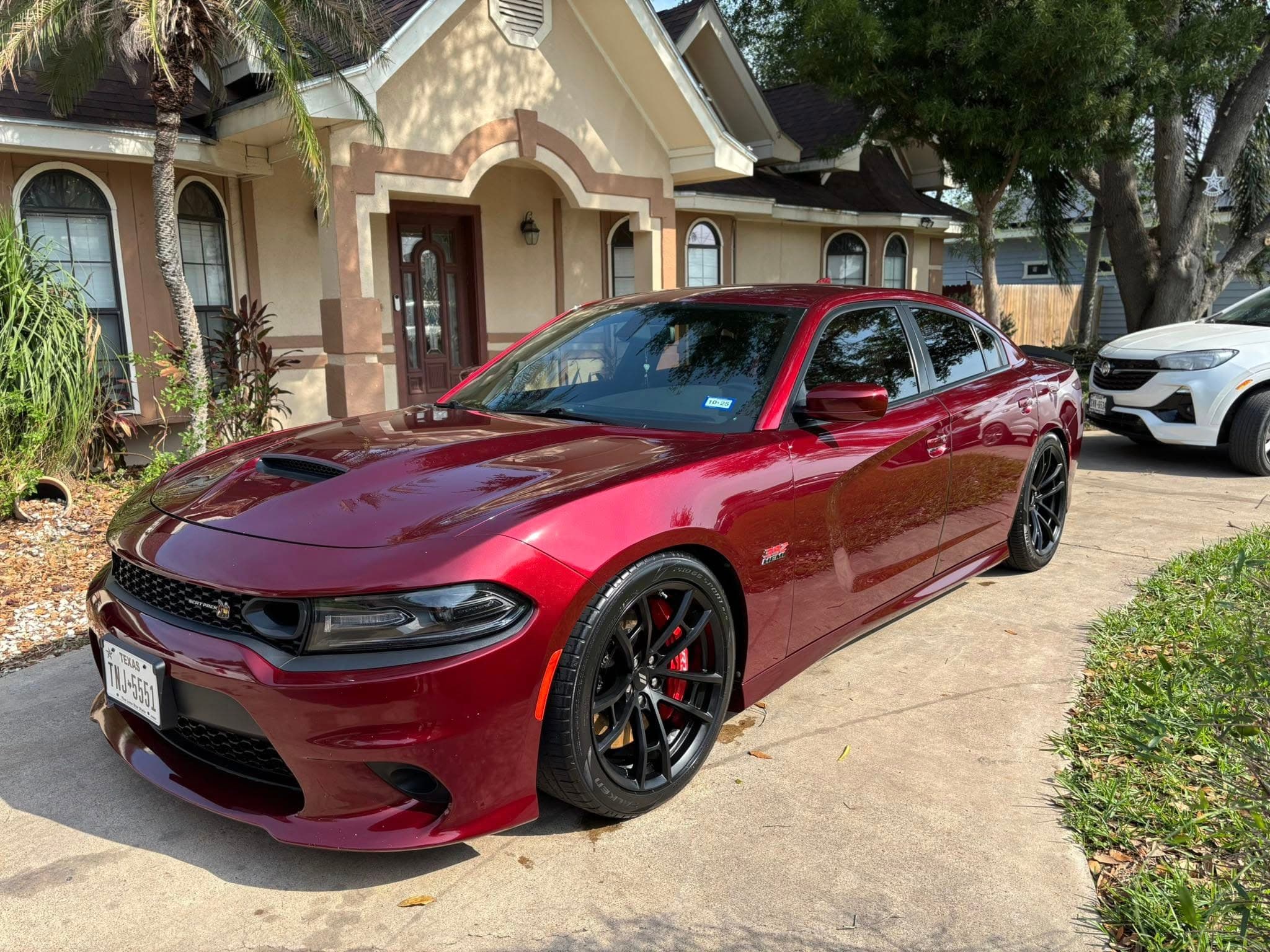Burgundy Dodge Charger with deep gloss and tinted windows