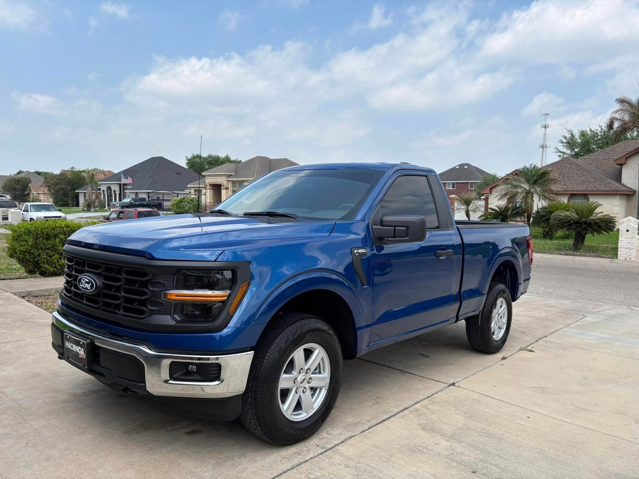 White Audi R8 with flawless polish parked under a covered bay